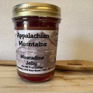 Jar of Appalachian Muscadine jelly on wood